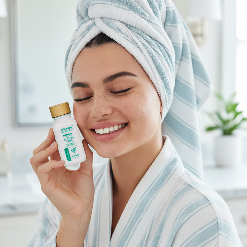 Woman with a towel wrapped around her head holding a bottle of HTT.